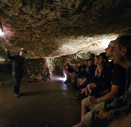 A NPS park ranger speaks to a group of visitors deep inside Lehman Caves.
